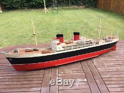 Model boat. Vintage electric powered ship, carved wood hull